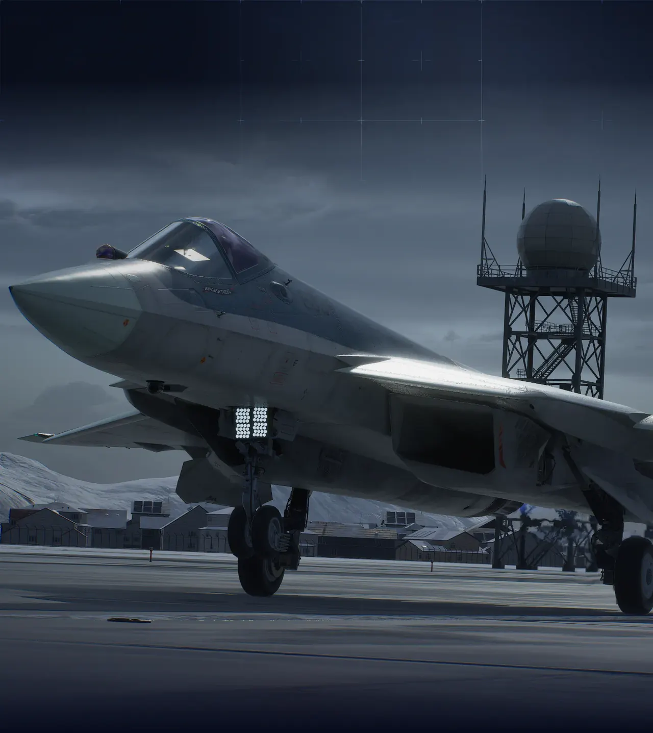 Fighter jet on a runway beside ground support equipment